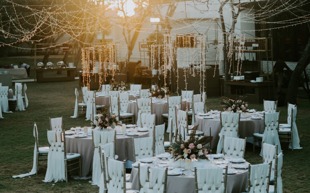 Tables set for a small, intimate wedding dinner in an outdoor setting