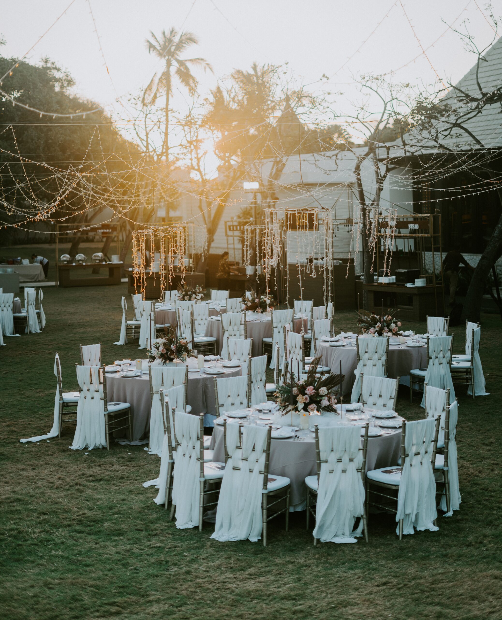 Tables set for a small, intimate wedding dinner in an outdoor setting